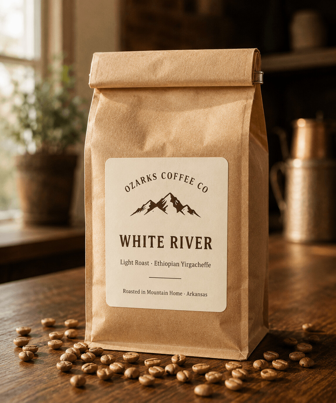 A kraft-paper bag of White River Light Roast with a cream label, on a wooden surface.